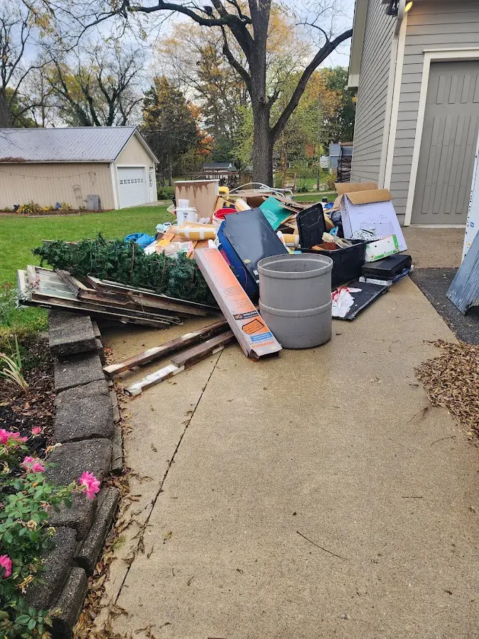 Dumpster being loaded with debris for Estate Cleanout Dumpster Rental in Fountain Valley